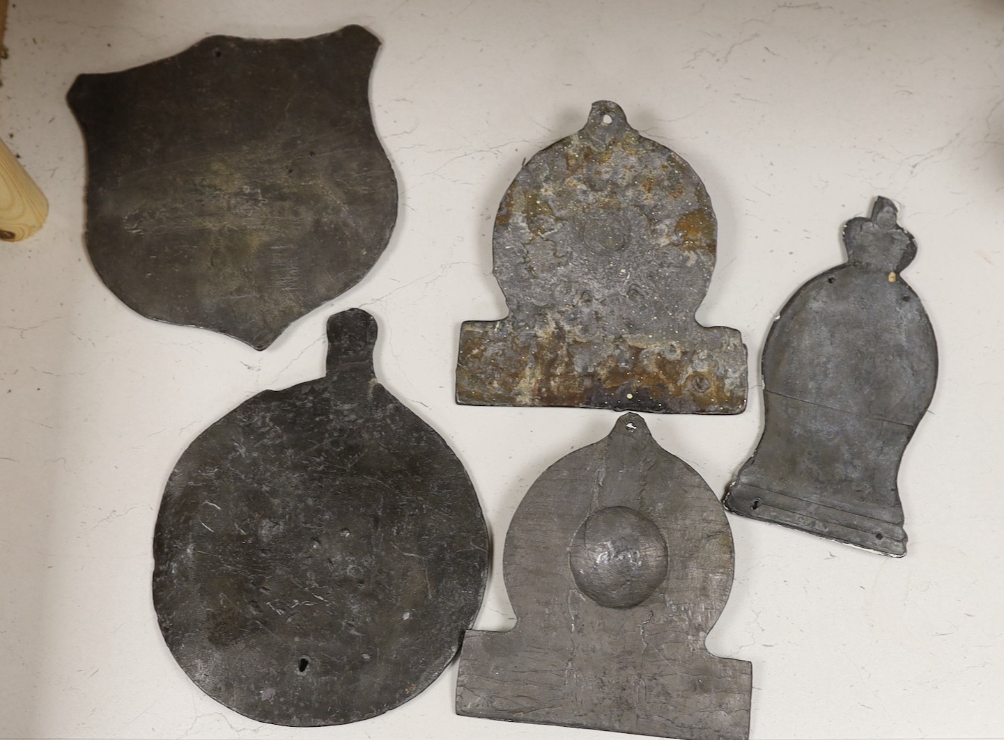 Five lead firemarks, the largest 25cm high